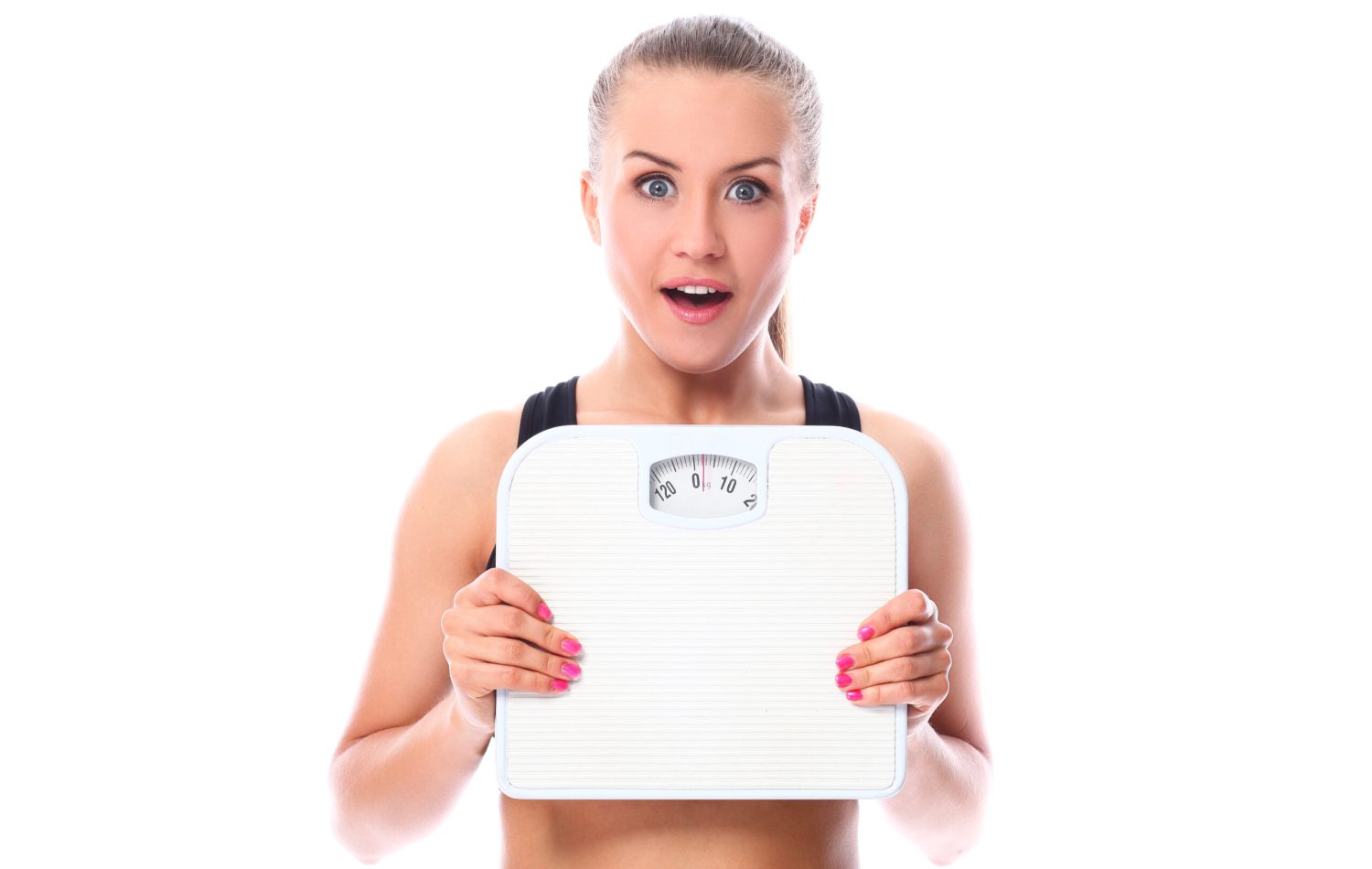 Beautiful fitness girl holding scales weight control