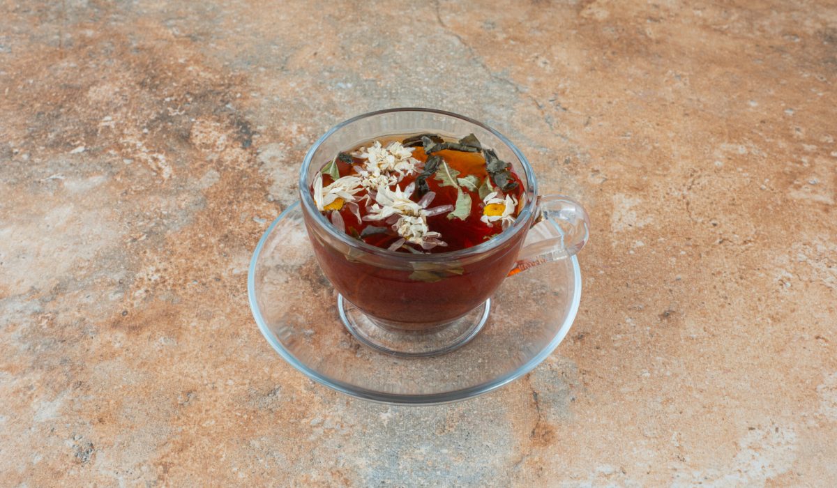 A cup of aroma herbal tea on marble background digestion