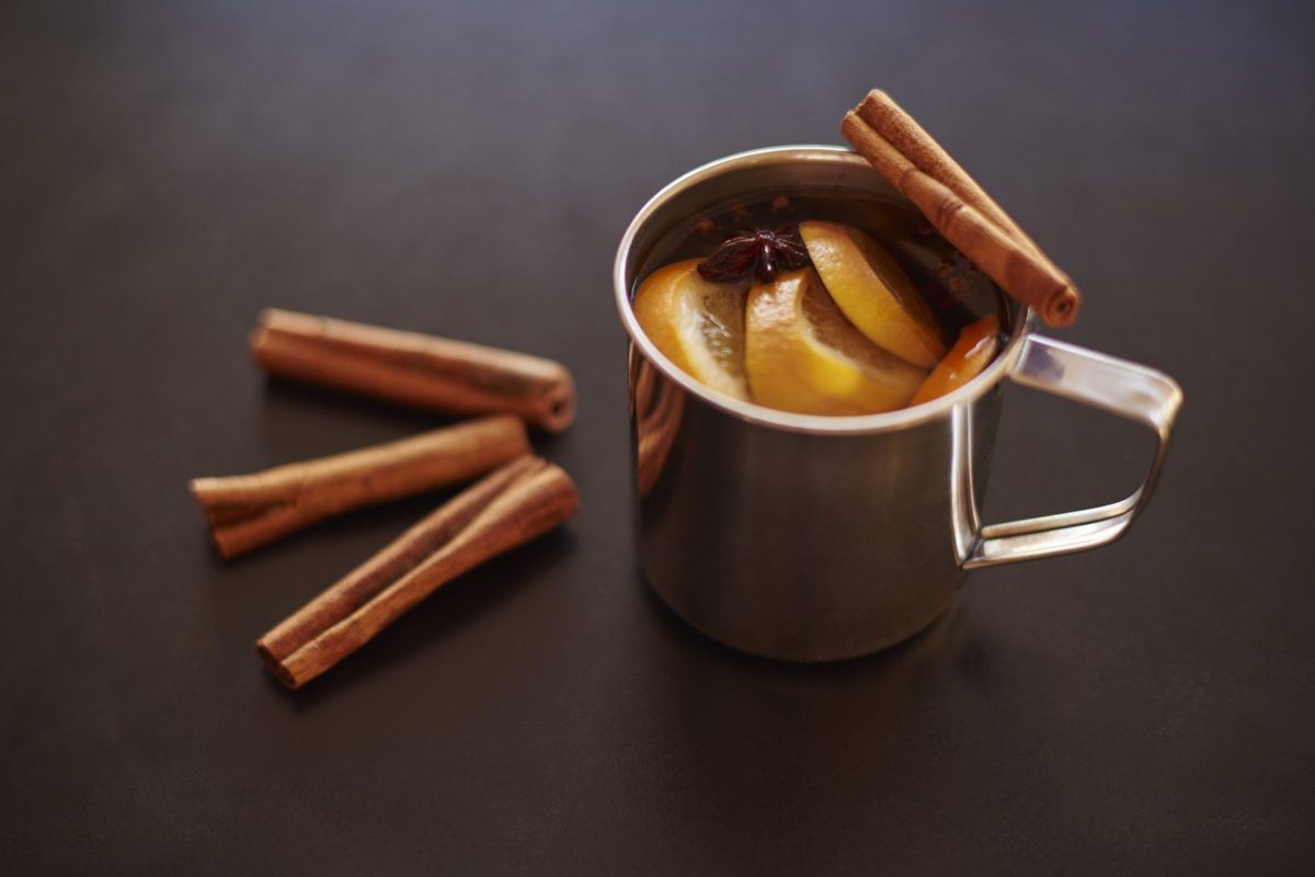 Cup of mulled wine with cinnamon stick Cup of mulled wine with cinnamon stick