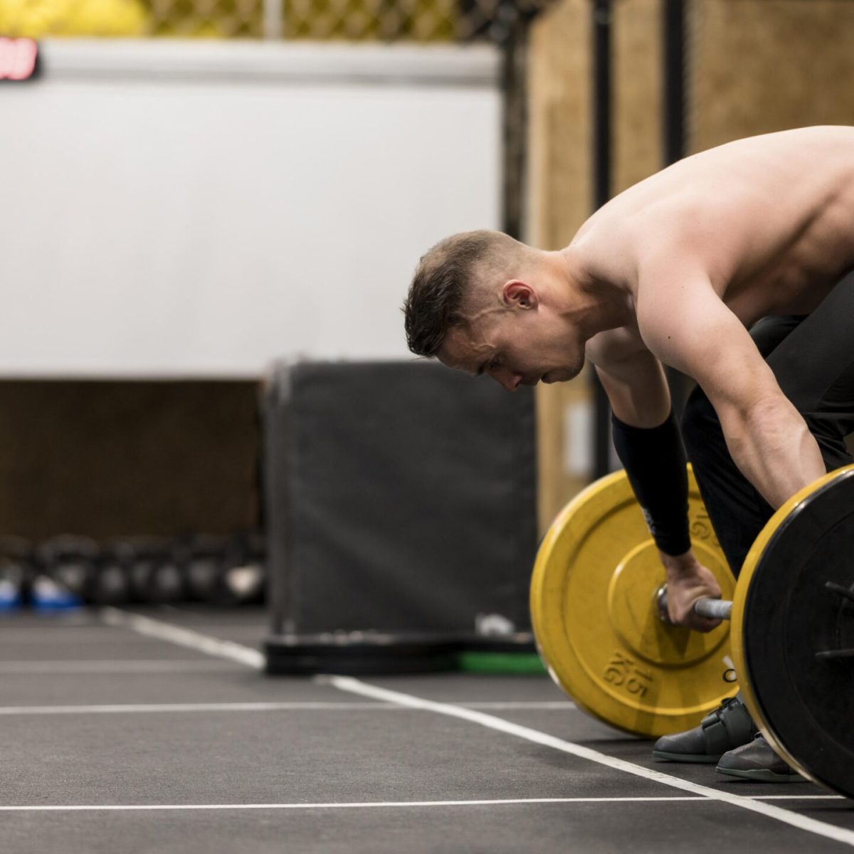 high-angle-male-training-with-weightlifting high-angle-male-training-with-weightlifting